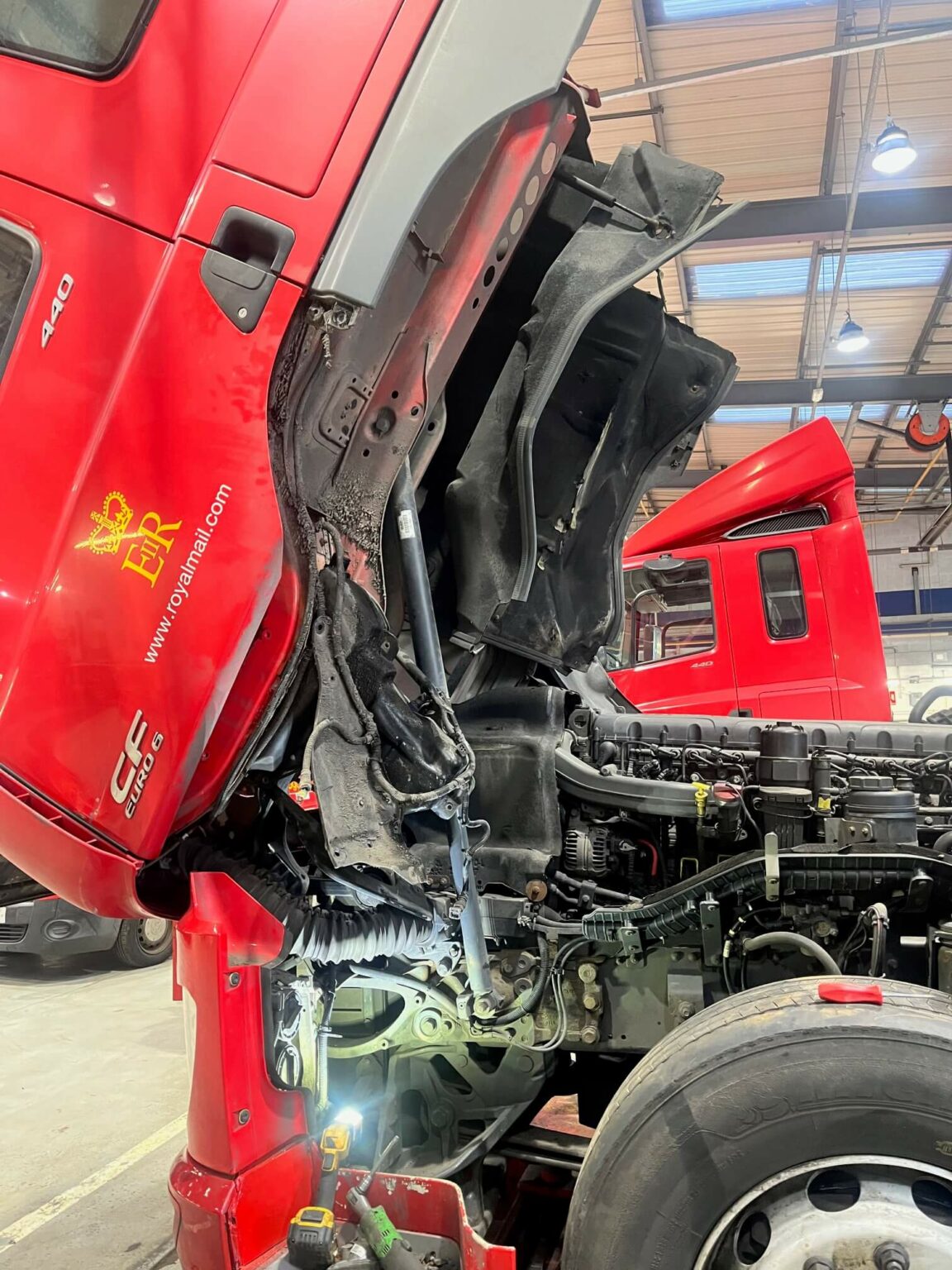 Red Royal Mail lorry having body work repairs carried ou